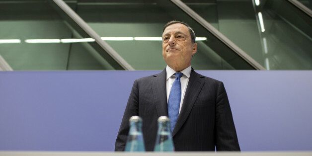 Mario Draghi, president of the European Central Bank (ECB), pauses before taking his seat for a news conference to announce the bank's interest rate decision at the ECB headquarters in Frankfurt, Germany, on Thursday, Dec. 3, 2015. The euro dropped the most in almost two weeks versus the dollar as investors braced for a European Central Bank meeting Thursday that economists said will result in policy makers expanding monetary stimulus. Photographer: Jasper Juinen/Bloomberg via Getty Images