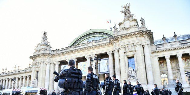French police forces stand in front of the 'Solutions COP21' exhibition at the Grand Palais in Paris after a demonstration on December 4, 2015 as part of the COP 21, the United Nations conference on climate change.More than 150 world leaders are meeting under heightened security, for the 21st Session of the Conference of the Parties to the United Nations Framework Convention on Climate Change COP21/CMP11) from November 30 to December 11. / AFP / LOIC VENANCE (Photo credit should read LOIC VENANCE/AFP/Getty Images)