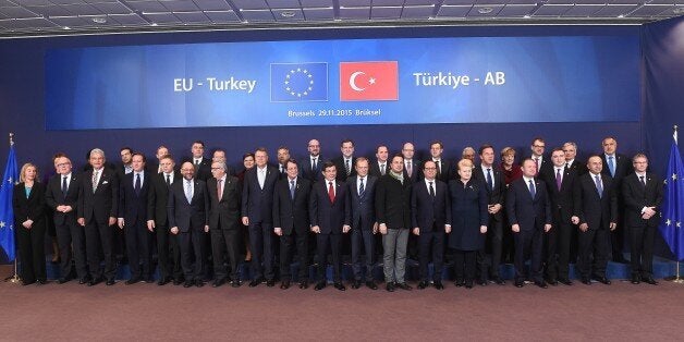 (Back L-R) Greek Prime Minister Alexis Tsipras, Ireland's Prime Minister Enda Kenny, Croatia's Prime Minister Zoran Milanovic, Denmark's Prime Minister Lars Lokke Rasmussen, Poland's Prime Minister Beata Szydlo, Hungary's Prime Minister Viktor Orban, Belgium's Prime Minister Charles Michel, Spain's Prime Minister Mariano Rajoy, Sweden's Prime Minister Stefan Lofven, Czech Republic's Prime Minister Bohuslav Sobotka, Slovenia's Prime Minister Miro Cerar, Portugal's Prime Minister Antonio Costa, Germany's Chancellor Angela Merkel, Finland's Prime Minister Juha Sipila, Austria's Chancellor Werner Faymann, Bulgaria's Prime minister Boyko Borissov, (Front L-R) EU foreign policy chief Federica Mogherini, EU Commission vice president Frans Timmermans, Turkish Minister for EU Affairs Volkan Bozkir, British Prime Minister David Cameron, Slovakia's Prime Minister Robert Fico, European Parliament president Martin Schulz, European Commission president Jean-Claude Juncker, Romania's President Klaus Werner Iohannis, Cyprus' President Nicos Anastasiades, European Council President Donald Tusk, Luxembourg's Prime Minister Xavier Bettel, French President Francois Hollande, Lithuania's President Dalia Grybauskaite, Netherlands' Prime Minister Mark Rutte, Malta's Prime minister Joseph Muscat and Estonia's Prime Minister Taavi Roivas pose for a family picture during a summit on relations between the European Union and Turkey and on the migration crisis at the European Council in Brussels on November 29, 2015. AFP PHOTO / EMMANUEL DUNAND / AFP / EMMANUEL DUNAND (Photo credit should read EMMANUEL DUNAND/AFP/Getty Images)