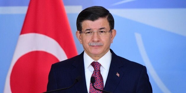 Turkish Prime Minister Ahmet Davutoglu speaks during a press conference at the NATO headquarters on November 30, 2015 in Brussels. AFP PHOTO / EMMANUEL DUNAND / AFP / EMMANUEL DUNAND (Photo credit should read EMMANUEL DUNAND/AFP/Getty Images)