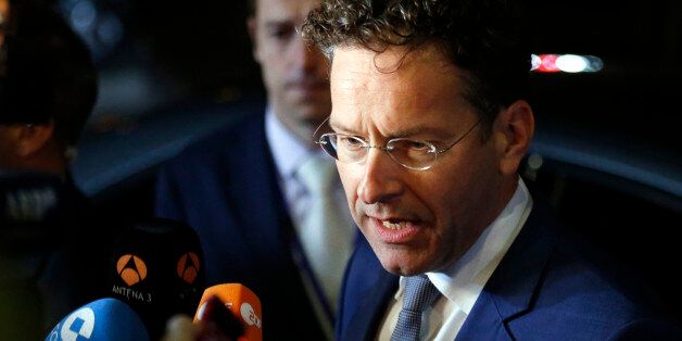 Dutch Finance Minister Jeroen Dijsselbloem speaks with the media as he leaves after a meeting of eurozone finance ministers at the EU Lex building in Brussels on Sunday, July 12, 2015. Greece's negotiators head to Brussels on Saturday armed with their reform proposals and parliamentary backing to seek a third bailout, but with the shadow of severe dissent from governing lawmakers hanging over them. (Francois Lenoir/Pool Photo via AP)