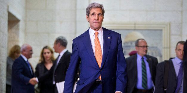 US Secretary of State John Kerry walks towards members of the media after meeting with Palestinian president Mahmud Abbas in the West Bank city of Ramallah on November 24, 2015. Kerry is holding talks with Israeli and Palestinian leaders in a bid to ease a wave of violence that left 92 Palestinians dead, including one Arab Israeli, as well as 17 Israelis -- including the two Israeli-Americans -- one American and an Eritrean. AFP PHOTO / POOL / JACQUELYN MARTIN / AFP / POOL / JACQUELYN MARTIN (Photo credit should read JACQUELYN MARTIN/AFP/Getty Images)