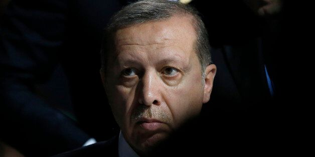 Turkey's President Recep Tayyip Erdogan listens to statements at the COP21, United Nations Climate Change Conference, in Le Bourget, outside Paris, Monday, Nov. 30, 2015. (AP Photo/Francois Mori)