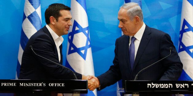 Israel's Prime Minister Benjamin Netanyahu, right, and Greece's Prime Minister Alexis Tsipras, hold joint a press conference, in Jerusalem, Wednesday, Nov. 25, 2015. (Ronen Zvulun/Pool Photo via AP)