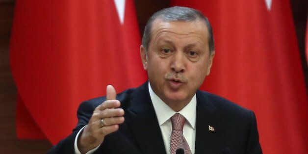 Turkish President Recep Tayyip Erdogan delivers a speech during a mukhtars meeting at the presidential palace on November 26, 2015 in Ankara. President Recep Tayyip Erdogan on November 26 said Turkey does not buy any oil from Islamic State, insisting that his country's fight against the jihadist group is 'undisputed'. AFP PHOTO/ADEM ALTAN / AFP / ADEM ALTAN (Photo credit should read ADEM ALTAN/AFP/Getty Images)