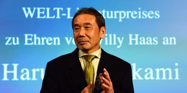 Japanese writer Haruki Murakami poses with his trophy prior to an award ceremony for the Germany's Welt Literature Prize bestowed by the German daily Die Welt, in Berlin on November 7, 2014. AFP PHOTO / JOHN MACDOUGALL (Photo credit should read JOHN MACDOUGALL/AFP/Getty Images)
