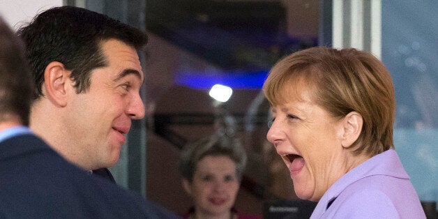 German Chancellor Angela Merkel, right, and Greek Prime Minister Alexis Tsipras share a laugh at the start of a second working session of a summit on migration between European and African leaders, in Valletta, Malta, Thursday, Nov. 12, 2015. (AP Photo/Alessandra Tarantino)