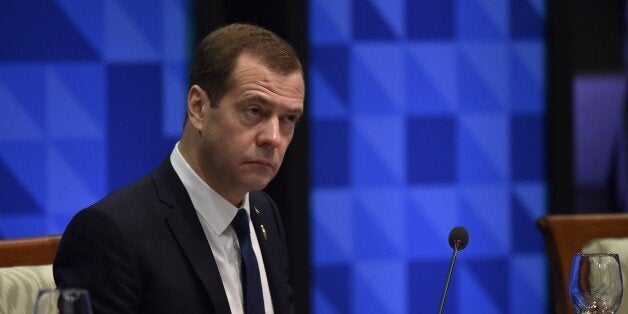 Russia's Prime Minister Dmitry Medvedev takes part in the leaders' 'Retreat 1' at the annual 21-member Asia-Pacific Economic Cooperation (APEC) summit in Manila on November 19, 2015. Asia-Pacific leaders are wrapping up two-days of talks in Manila that have been overshadowed by an arm-wrestle for regional influence between the United States and China. AFP PHOTO / PHILIPPE LOPEZ (Photo credit should read PHILIPPE LOPEZ/AFP/Getty Images)