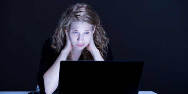 Image of despair and sad female victim of online violence
