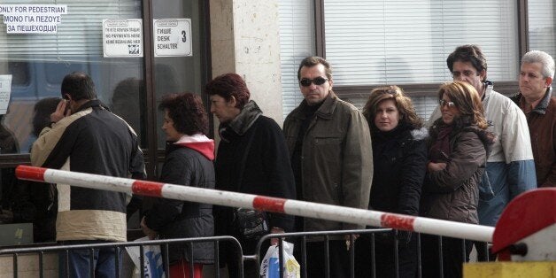 (FILES) An undated, recent file photo shows Bulgarians waiting to cross the border into Greece, near...