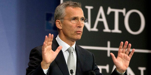 NATO Secretary General Jens Stoltenberg speaks during a media conference at NATO headquarters in Brussels on Tuesday, Oct. 6, 2015. NATO defense ministers will meet on Thursday, Oct. 8, 2015 to discuss, among other issues, the situation after a Russian fighter jet entered Turkish airspace from Syria over the weekend. (AP Photo/Virginia Mayo)