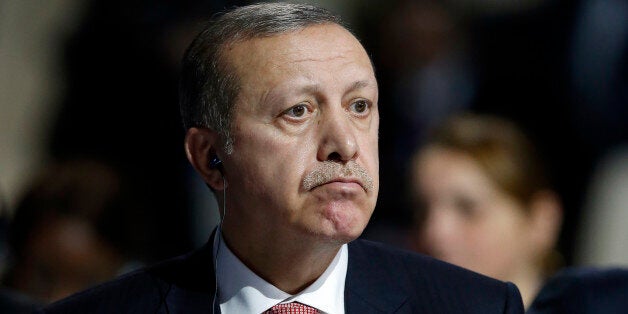 Turkey's President Recep Tayyip Erdogan listens to statements at the COP21, United Nations Climate Change Conference, in Le Bourget, outside Paris, Monday, Nov. 30, 2015. (AP Photo/Francois Mori)