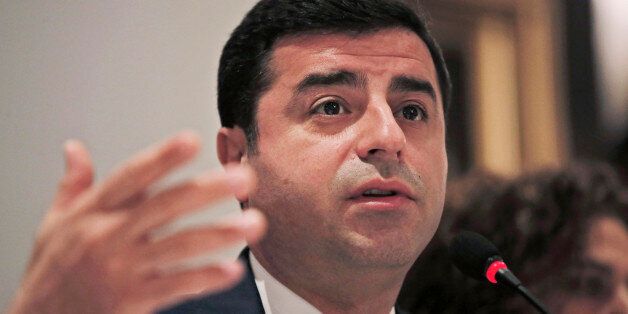 Selahattin Demirtas, co-leader of the pro-Kurdish Democratic Party of Peoples (HDP) gestures as he talks during a meeting with representatives of minorities living inTurkey at a hotel in central Istanbul, Wednesday, Oct. 28, 2015, ahead of the Nov. 1 general elections. (AP Photo/Lefteris Pitarakis)
