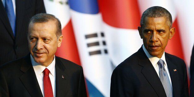 ANTALYA, TURKEY - NOVEMBER 15: US President Barack Obama (R) and President of Turkey Recep Tayyip Erdogan (L) pose for a family photo within the G20 Turkey Leaders Summit on November 15, 2015 in Antalya, Turkey. (Photo by Mehmet Ali Ozcan/Anadolu Agency/Getty Images)