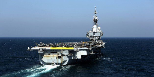 View of the French navy aircraft carrier Charles de Gaulle operating in the Gulf on February 26, 2015. French warplanes carried out their first strikes on February 25, 2015 since the warship joined the fight against jihadists in Iraq. AFP PHOTO / PATRICK BAZ (Photo credit should read PATRICK BAZ/AFP/Getty Images)