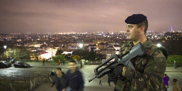 A French soldier enforcing the Vigipirate plan, France's national security alert system, patrols in front of the Sacre Coeur Basilica on November 16, 2015 in Paris, three days after a series of deadly coordinated attacks claimed by Islamic State jihadists, which killed at least 129 people and left more than 350 injured on November 13. AFP PHOTO/JOEL SAGET (Photo credit should read JOEL SAGET/AFP/Getty Images)