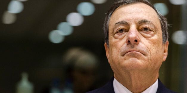 President of the European Central Bank Mario Draghi addresses the committee on economic and monetary affairs at the European parliament in Brussels Thursday, Nov. 12, 2015. (AP Photo/Geert Vanden Wijngaert)