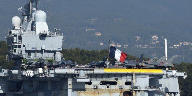 Charles de Gaulle, the flagship of the French Navy and the largest western European warship currently in commission, is seen anchored in the military port of Toulon, on November 17, 2015, before leaving on mission in Mediterranean Sea to take part in operations on Syria. AFP PHOTO / ANNE-CHRISTINE POUJOULAT (Photo credit should read ANNE-CHRISTINE POUJOULAT/AFP/Getty Images)