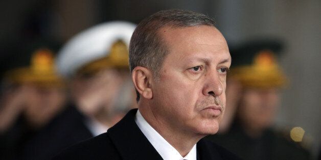 Turkey's President Recep Tayyip Erdogan stands at the mausoleum to remember the nationâs founding father Mustafa Kemal Ataturk on the 77th anniversary of his death, in Ankara, Turkey, Tuesday, Nov. 10, 2015.(AP Photo/Burhan Ozbilici)