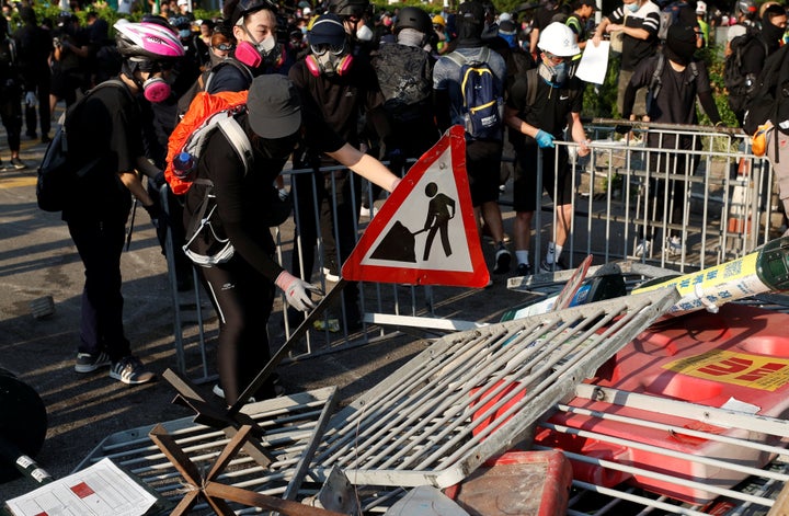 Anti-government protesters make a barricade during a march in Tuen Mun, Hong Kong on Sept. 21, 2019.