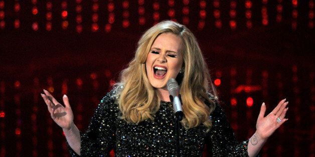 FILE - In this Feb. 24, 2013 file photo, Adele performs during the Oscars at the Dolby Theatre in Los Angeles. Adeleâs âHelloâ single has become the first song to sell one million tracks in a week. Her comeback track sold 1.11 million digital songs, setting a new record. Her complete album