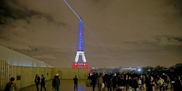 PARIS, FRANCE - NOVEMBER 16: The Eiffel Tower is illuminated in Red, White and Blue in honour of the victims of Friday's terrorist attacks on November 16, 2015 in Paris, France. Countries across Europe joined France today to observe a one minute-silence in an expression of solidarity with the victims of the terrorist attacks, which left at least 129 people dead and hundreds more injured. on November 16, 2015 in Paris, France. (Photo by Pierre Suu/Getty Images)