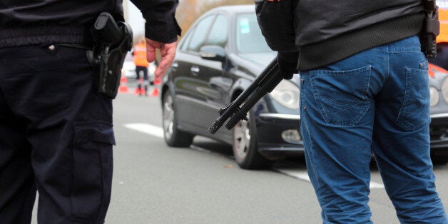 BAISIEUX, FRANCE - NOVEMBER 14: French border and customs police control vehicles at the France-Belgium border at Baisieux, near Lille in Northern France as a state of emergency is declared following the Paris terrorist attacks on November 14, 2015 in Baisieux, France. Atleast 120 people have been killed and over 200 injured, 80 of which seriously, following a series of terrorist attacks in the French capital. (Photo by Sylvain Lefevre/Getty Images)