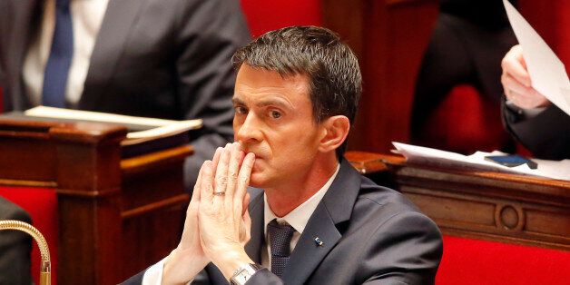 French Prime Minister Manuel Valls is concentrated after he addressed the parliament at the national assembly in Paris, Thursday Nov.19,2015. Valls is warning that the associates of extremists who targeted France last week could use chemical and biological weapons, as he urged Parliament to extend a state of emergency. (AP Photo/Michel Euler)