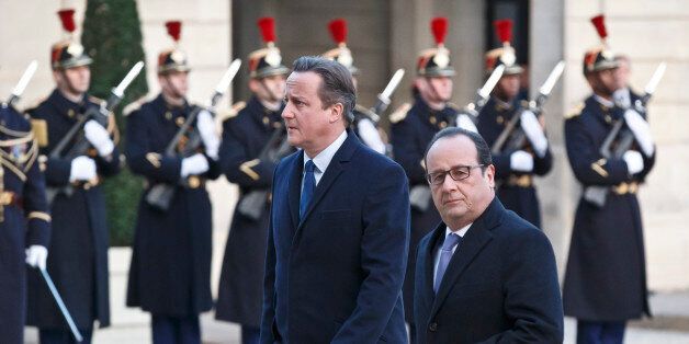 Britain's Prime Minister David Cameron, left, and France's President Francois Hollande arrive at the Elysee Palace in Paris, Monday, Nov. 23, 2015. French President Francois Hollande and British Prime Minister David Cameron have paid a visit to the Bataclan concert venue in central Paris, which saw the worst carnage of the Paris attacks that killed over 120 people. (AP Photo/Michel Euler)