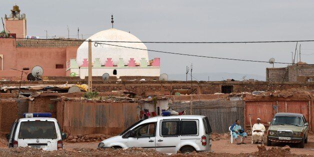 Police vehicles are parked outside the Bouya Omar mausoleum on June 11, 2015, during the 'al-Karama' (Dignity) initiative conducted by the Moroccan authorities to relocate some eight hundred mentally ill patients from the sanctuary whom rights activists say are victim of maltreatment. Followers of Bouya Omar, a 16th-century Moroccan saint, claim the mentally ill are healed by the saint's supernatural powers, but rights groups allege gross abuse of those taken there, with one former inmate describing his stay there as the months of 'hell'. AFP PHOTO / FADEL SENNA (Photo credit should read FADEL SENNA/AFP/Getty Images)