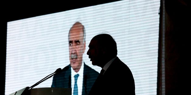 Evangelos Meimarakis, leader of the New Democracy Party of Greece, is silhouetted against a video screen as he speaks during a pre-election rally in Athens, Greece, on Thursday, Sept. 17, 2015. Alexis Tsipras stepped down on Aug. 20 after eight months in power, announcing new parliamentary elections following the political turmoil resulting from his government's signing of a third bailout agreement with Greece's creditors in August. Photographer: Kostas Tsironis/Bloomberg via Getty Images