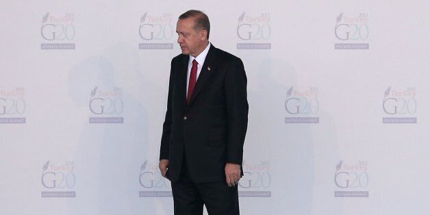 ANTALYA, TURKEY - NOVEMBER 15: Russian President, Vladimir Putin, (L) talks with Turkish President Recep Tayyip Erdogan, before leaving the arrival area during the official welcome ceremony on day one of the G20 Turkey Leaders Summit on November 15, 2015 in Antalya, Turkey. World leaders will use the summit to discuss issues including, climate change, the global economy, the refugee crisis and terrorism. The two day summit takes place in the wake of the massive terrorist attack in Paris which killed more than 120 people. (Photo by Chris McGrath/Getty Images)