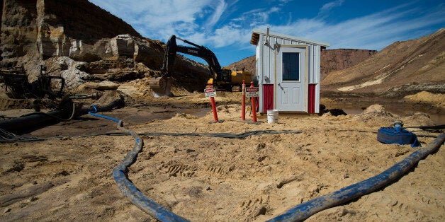 The hydraulic mining operator booth stands at the Superior Silica Sands LLC facility in Barron, Wisconsin, U.S., on Thursday Sept. 10, 2015. A little-known offshoot of the shale oil revolution that swept across America over the past decade is the market for sand -- the grit that props open the rocks and makes fracking possible -- transforming almost overnight what had been a sleepy industry that sold primarily to the likes of glass makers and golf courses. So when the shale boom went bust, it took down the sand industry with it. Some mines in the Midwest region have cut their workforce and output in half and many smaller operations have closed entirely. Photographer: Rachel Woolf/Bloomberg via Getty Images