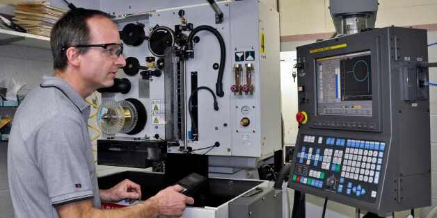 A technician works on a a precision cutting machine to cut magnets for odd-shaped applications during the manufacturing process for high-powered samarium-cobalt magnets at the Electron Energy Corp. factory in Landisville, Pennsylvania, U.S., on Tuesday, March 9, 2010. Electron Energy is the only U.S. company that makes magnets used in defense equipment with samarium, a rare earth element. A generation after Chinese leader Deng Xiaoping made mastering neodymium and 16 other elements known as rare