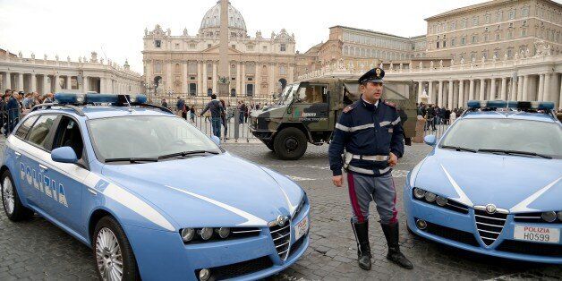 Police and Carabinieri stand guard outside St. Peter's square at the Vatican on November 14, 2015, a day after deadly attacks in Paris. Pope Francis said today he was 'shaken' by what he described as the 'inhuman' attacks on a string of Paris venues which left at least 128 people dead. AFP PHOTO / VINCENZO PINTO (Photo credit should read VINCENZO PINTO/AFP/Getty Images)