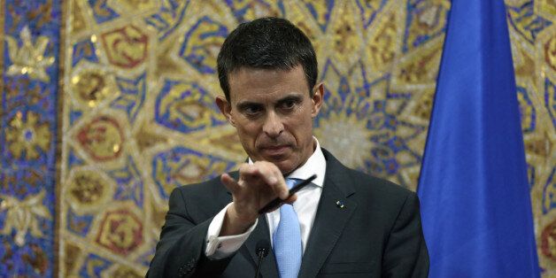 French Prime Minister Manuel Valls holds a press conference with Jordanian Prime Minister Abdullah Ensour in Amman, Jordan, Sunday, Oct. 11, 2015. (AP Photo/Raad Adayleh)