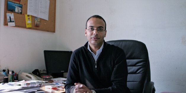 FILE -- This Dec. 7, 2011 photo, shows Hossam Bahgat in his office at the Egyptian Initiative for Personal Rights in Garden City, Cairo, Egypt. Egypt's military released Bahgat, a leading investigative journalist and human rights advocate on Tuesday, Nov. 10, 2015, who had been detained under accusations of spreading