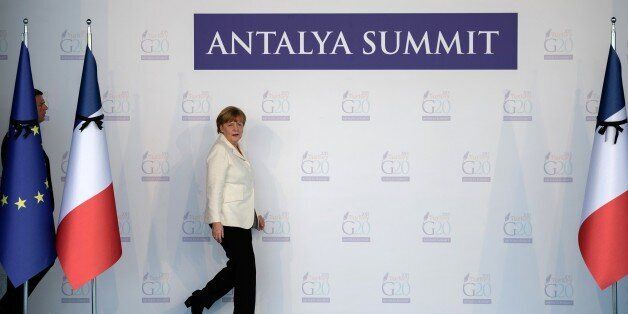 German Chancellor Angela Merkel arrives to observe a minute of silence with European Union leaders in tribute to the victims of the Paris attacks, during the G20 Summit on November 16, 2015 in Antalya. The attacks, claimed by Islamic State, killed at least 129 people and left more than 350 injured on November 13. AFP PHOTO/OZAN KOSE (Photo credit should read OZAN KOSE/AFP/Getty Images)