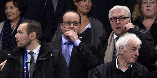 French President Francois Hollande (C) and Germany's Foreign Minister Frank-Walter Steinmeier (R) attend a friendly international football match between France and Germany ahead of the Euro 2016, on November 13, 2015 at the Stade de France stadium in Saint-Denis, north of Paris. AFP PHOTO / FRANCK FIFE (Photo credit should read FRANCK FIFE/AFP/Getty Images)