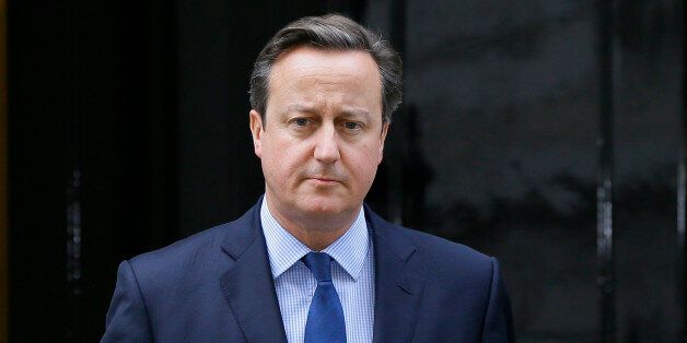 Britain's Prime Minister David Cameron arrives to make a statement about the death of Islamic State militant Mohammed Emwazi, known as