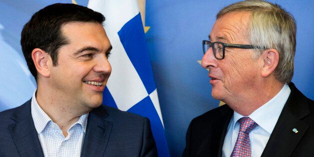 Greek Prime Minister Alexis Tsipras, left, speaks with European Commission President Jean-Claude Juncker prior to a meeting at EU headquarters in Brussels on Wednesday, June 24, 2015. Eurozone finance ministers meet Wednesday to discuss the Greek bailout. (Julien Warnand/Pool Photo via AP)
