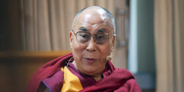Tibetan spiritual leader the Dalai Lama speaks at a panel discussion organized by US based American Enterprise Institute (AEI) at his residence in Dharmsala, India, Wednesday, Nov. 4, 2015. The delegates spoke on the role of business in eradicating poverty. (AP Photo/Ashwini Bhatia)
