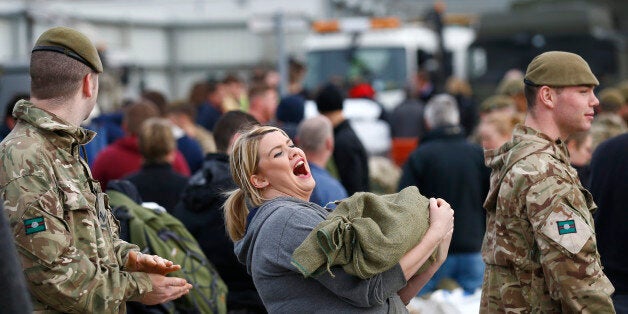 Soldiers and volunteers fill sand bags to assist with flood relief in York, in northern England, December 28, 2015. REUTERS/Darren Staples