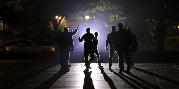 Residents are evacuated by the police in Saint Denis, north of Paris, France, Wednesday, Nov. 18, 2015. Authorities in the Paris suburb of Saint Denis are telling residents to stay inside during a large police operation near France's national stadium that two officials say is linked to last week's deadly attacks. (AP Photo/Thibault Camus)