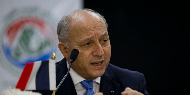 French Foreign Minister Laurent Fabius speaks at a press conference in New Delhi, India, Friday, Nov. 20, 2015. Fabius is in the country to hold talks with top Indian leaders ahead of the climate change conference in Paris. (AP Photo/ Manish Swarup)