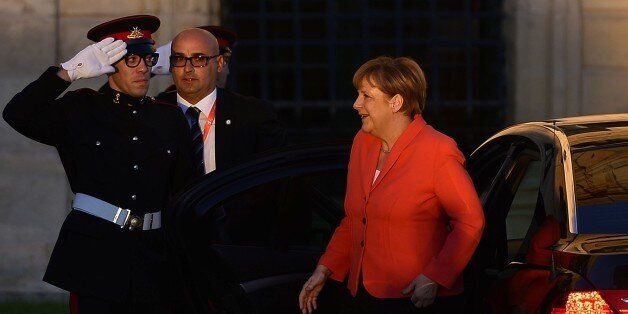 Germany's Chancellor Angela Merkel arrives at the Auberge de Castille in La Valletta on November 11, 2015 for the European Union - Africa Summit on Migration to cope with the biggest flow of refugees and migrants since World War II. EU leaders will meet their African counterparts in Malta today with pledges of billions of euros in aid in exchange for help in reducing migration to an overwhelmed Europe. The Europeans aim to ask African heads of state and government in Valletta to take back more economic migrants in return for up to 3.6 billion euros ($2 billion) to tackle root causes of migration like poverty and armed conflict. AFP PHOTO / FILIPPO MONTEFORTE (Photo credit should read FILIPPO MONTEFORTE/AFP/Getty Images)