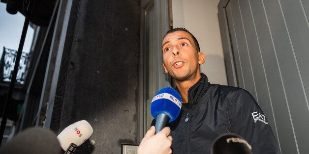Mohamed Abdeslam addresses the media at his house in the Molenbeek neighborhood in Brussels on Monday, Nov. 16, 2015. After his weekend detention, Mohamed Abdeslam was released by police, and spoke to reporters about his brother Brahim who died during a suicide attack Friday and his other brother Salah who is a fugitive, following terror attacks in Paris. (AP Photo/Leila Khemissi)