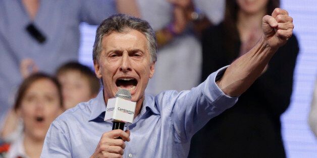 Opposition candidate Mauricio Macri celebrates after winning a runoff presidential election in Buenos Aires, Argentina, Sunday, Nov. 22, 2015. Macri won Argentina's historic runoff election against ruling party candidate Daniel Scioli, putting an end to the era of President Cristina Fernandez, who along with her late husband dominated Argentine politics for 12 years. (AP Photo/Ricardo Mazalan)
