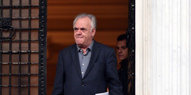 Greek Deputy Prime Minister Yiannis Dragasakis leaves the Prime Minister Alexis Tsipras' office in Athens at the end of the meeting between the Prime Minister and his top ministers on August 11, 2015. Greece on August 11 announced it had reached the outline of a deal for an international bailout worth 85 billion euros ($94 billion) that it hopes will save its economy from financial collapse. AFP PHOTO/ LOUISA GOULIAMAKI (Photo credit should read LOUISA GOULIAMAKI/AFP/Getty Images)