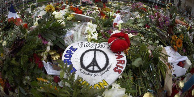 Flowers are placed next to the French embassy to Germany in Berlin November 20, 2015 in remembrance of the victims of the November 13 Paris attacks. At least 129 people were killed in a series of violent incidents across the French capital a week ago, on Friday, 13, with several deaths taking place near the Stade de France where France were playing Germany in a friendly international. AFP PHOTO / TOBIAS SCHWARZ (Photo credit should read TOBIAS SCHWARZ/AFP/Getty Images)